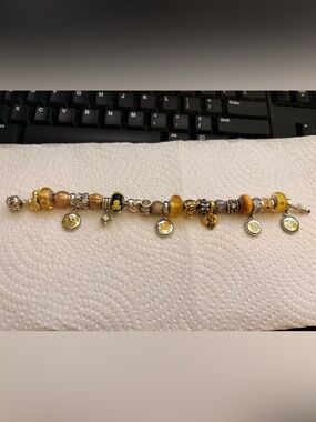 Pandora barrel clasp bracelet with yellow theme charms